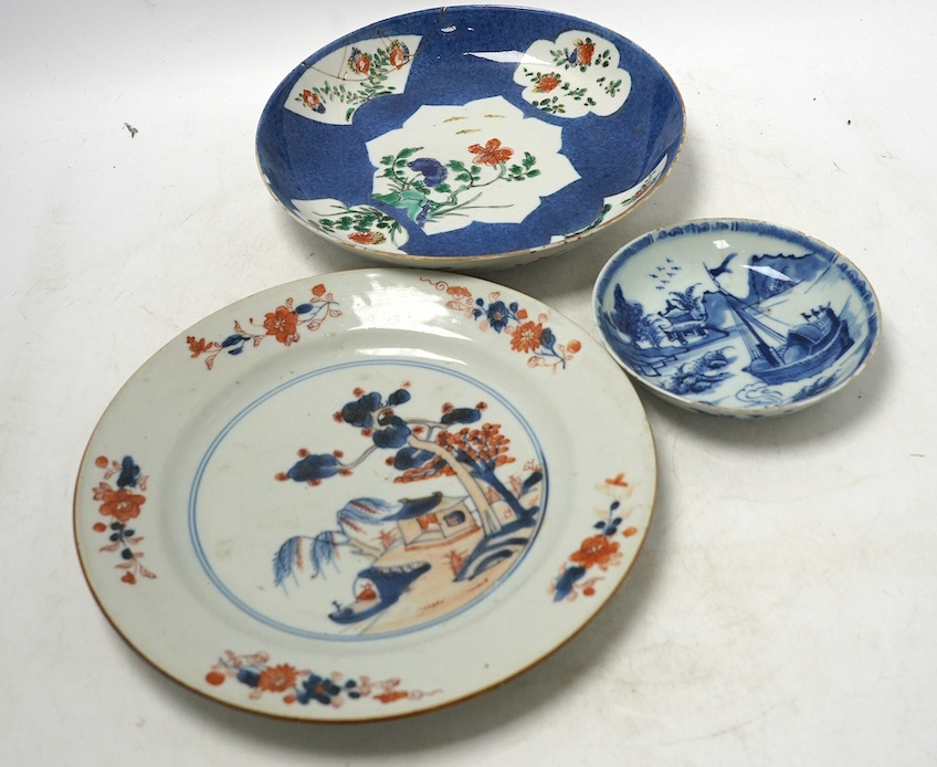 A Chinese powder blue famille verte dish, Kangxi period, a Yongzheng Imari plate and a Kangxi blue and white saucer, largest 22cm diameter. Condition - poor